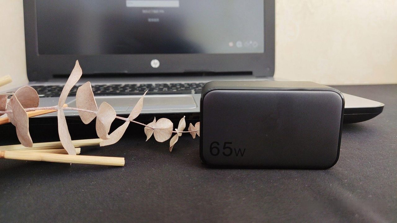 A single charger replacing a laptop brick, a phone adapter and an accessory charger