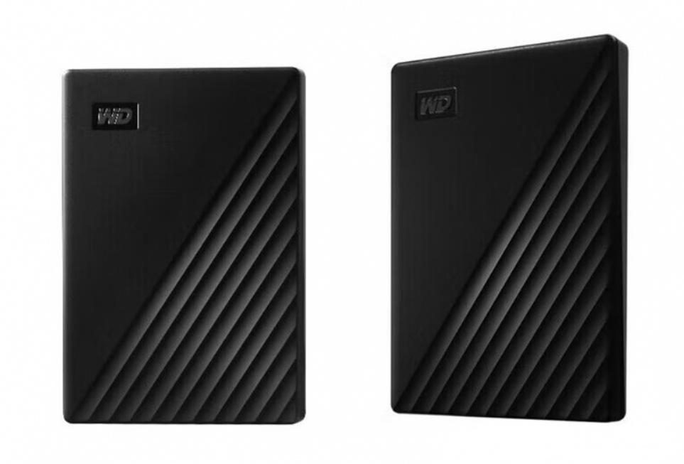 Two external hard drives standing side by side on a plain background