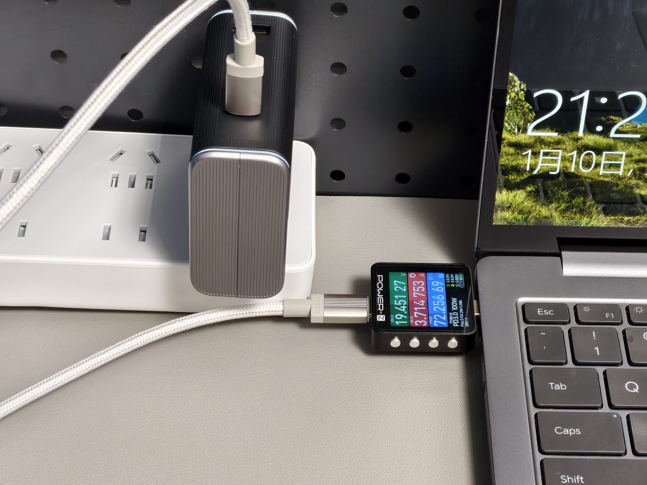 A desktop charger with a live display showing power as it is delivered
