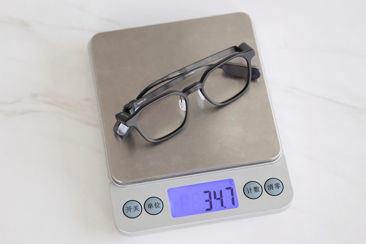 A pair of smart glasses standing on a kitchen scale