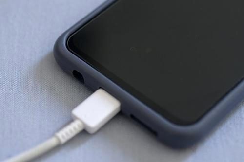 A phone connected to a fast-charging cable