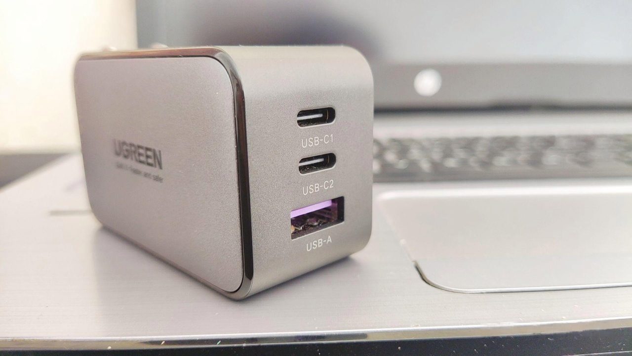 Two USB-C ports and one USB-A port on a small charger